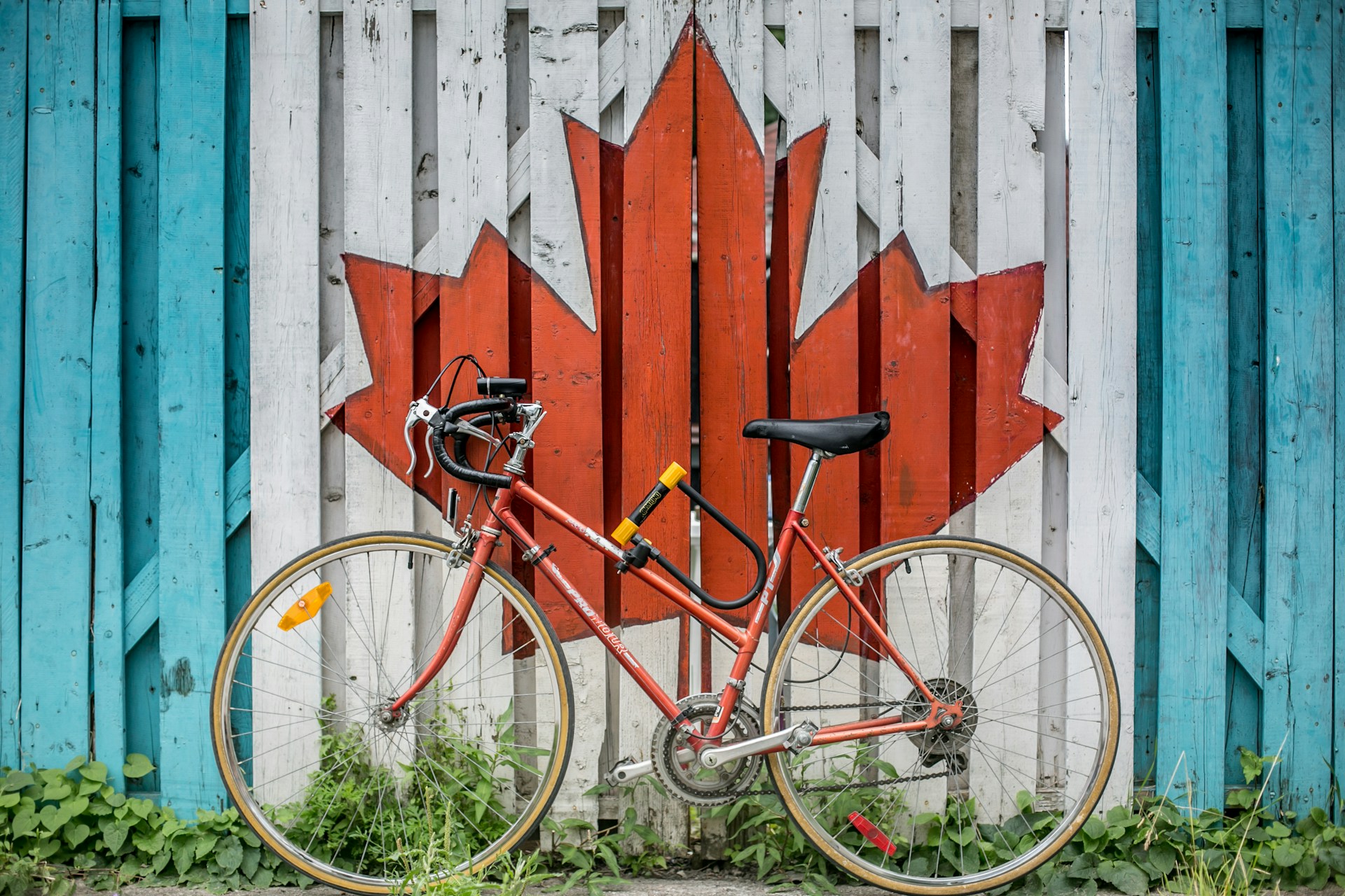 a bike in front of a Canadian logo